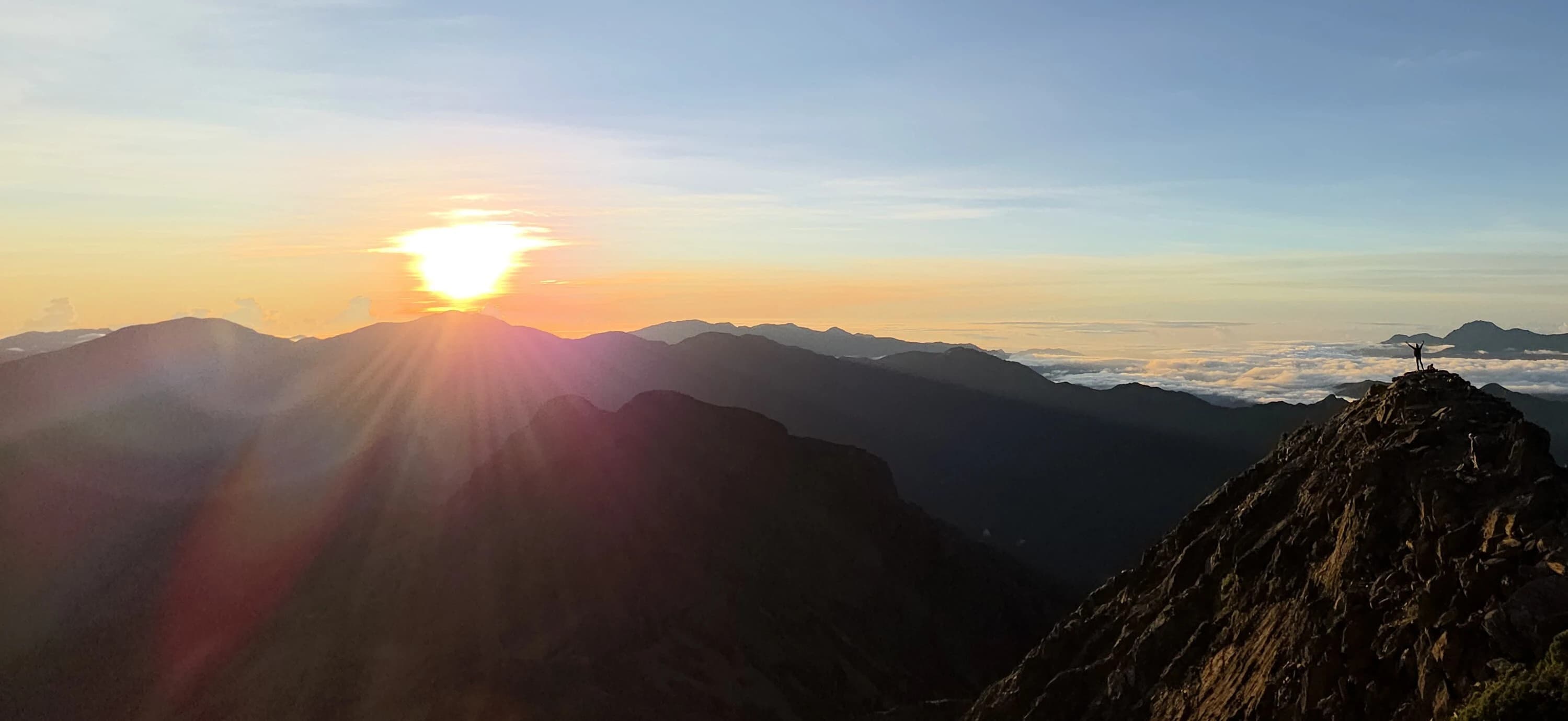 The unforgettable moment of reaching the summit of Yushan and witnessing the splendid sunrise.
